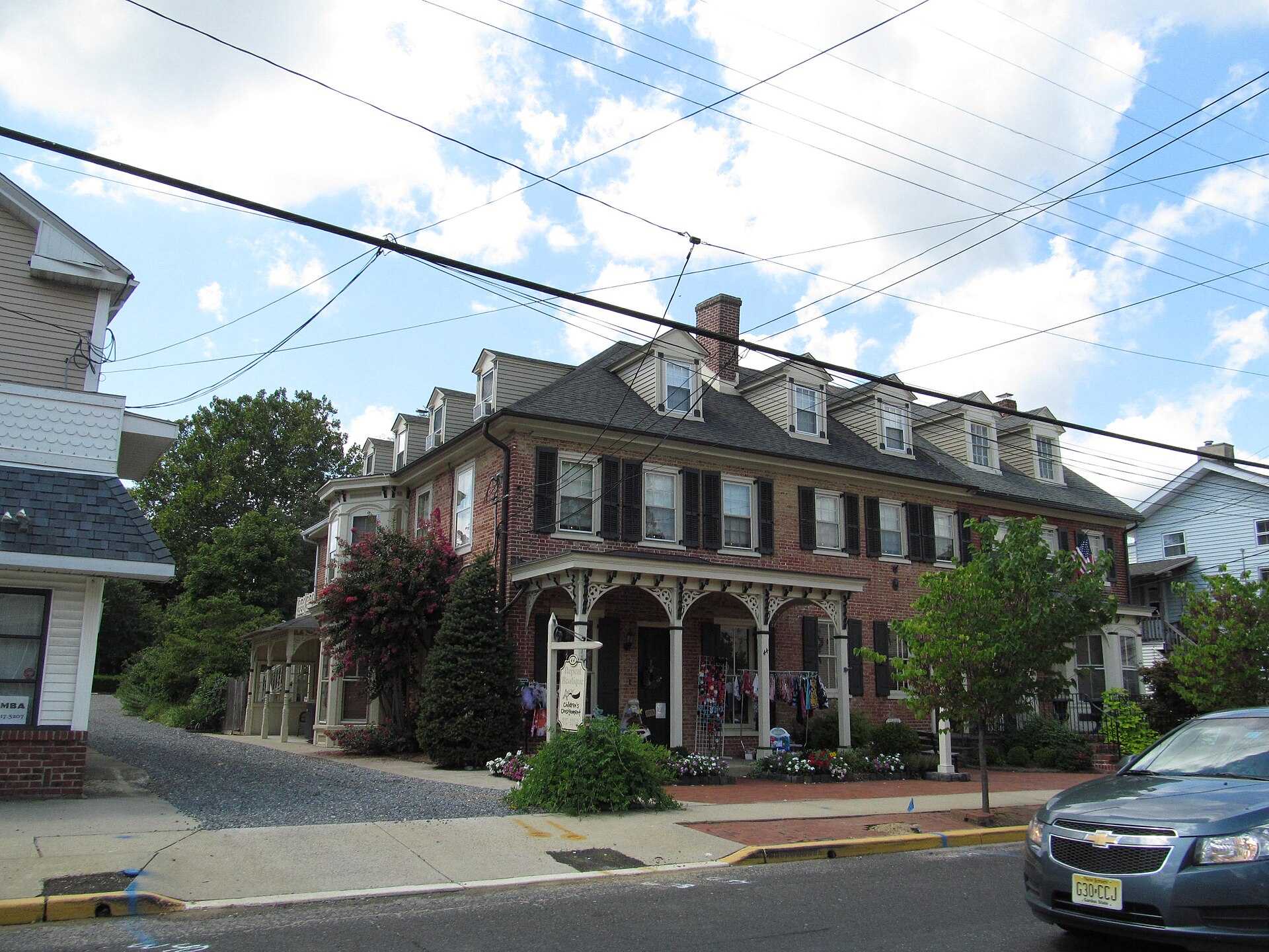 A brick building with a porch on Main Street